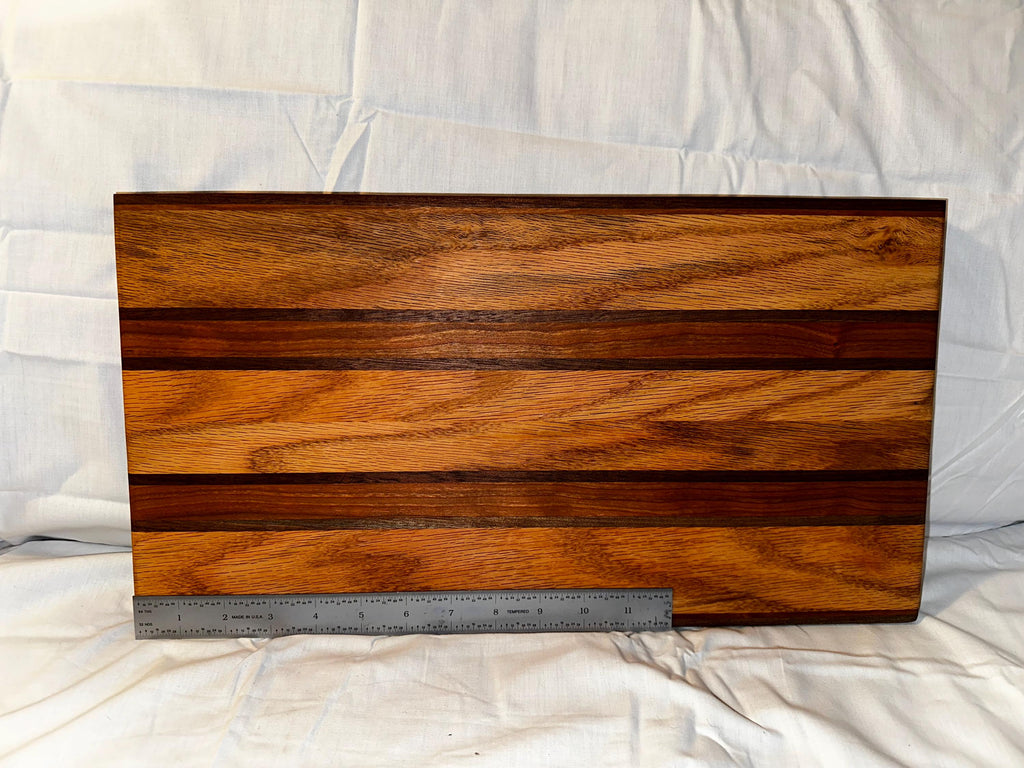 Cutting board made from reclaimed wood. Cherry, Oak and Walnut.