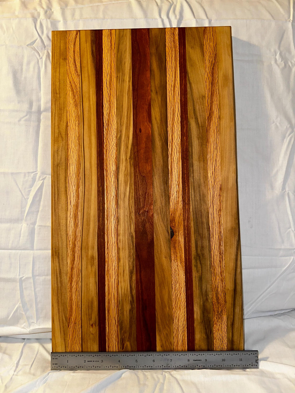Cutting board made from reclaimed wood. Cherry, Black gum, and Oak