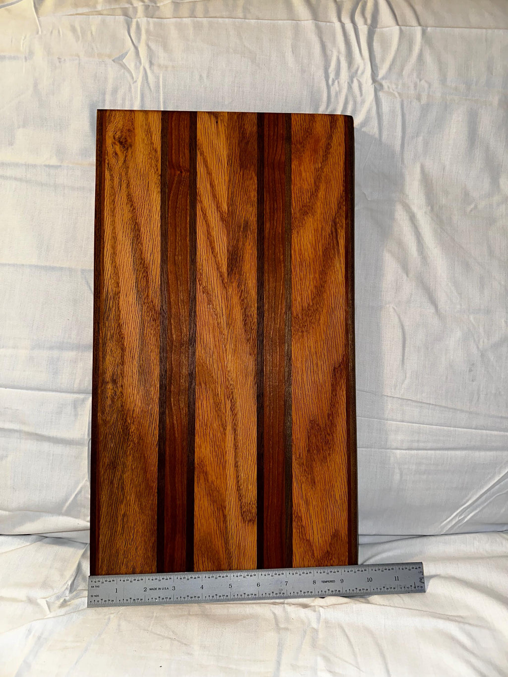 Cutting board made from reclaimed wood. Cherry, Oak and Walnut.